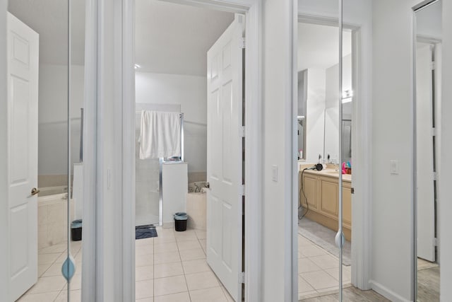 bathroom featuring tile patterned flooring and vanity