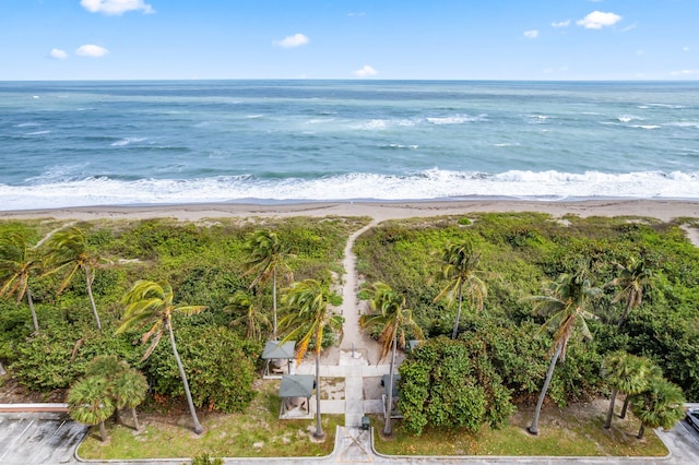 birds eye view of property with a view of the beach and a water view