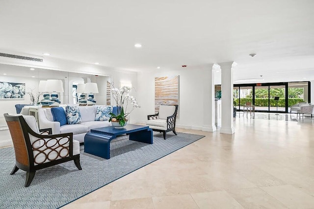 living room with decorative columns