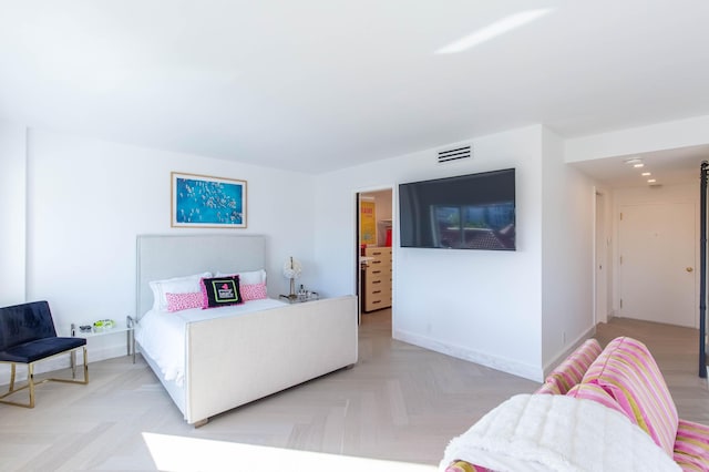 bedroom with light parquet floors