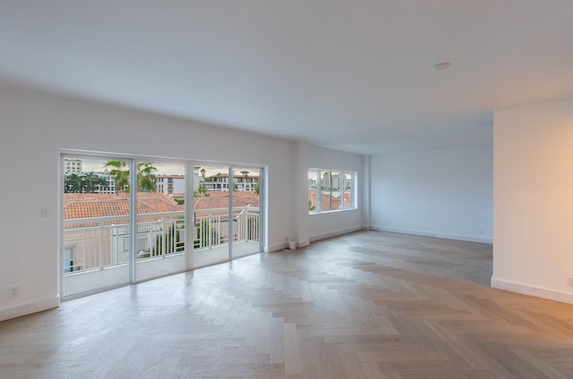 empty room with light parquet flooring