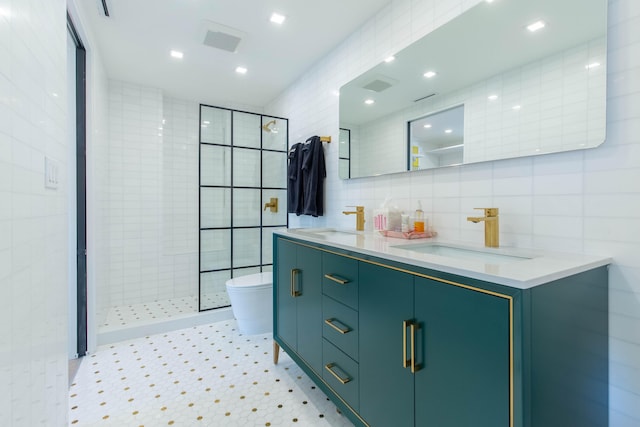 bathroom with tiled shower, toilet, tasteful backsplash, tile walls, and vanity