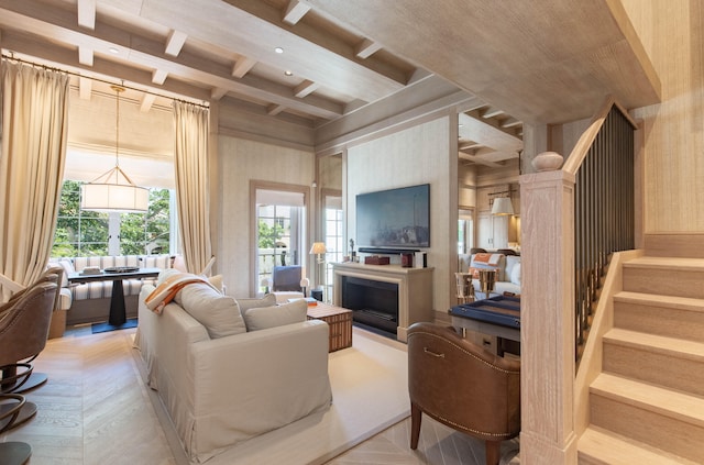 living room with light parquet floors and beam ceiling