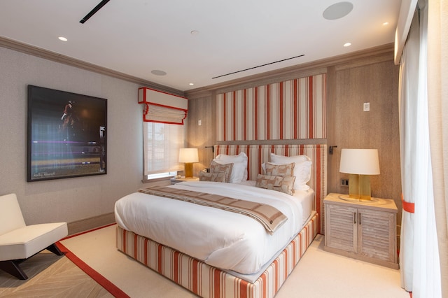 bedroom featuring ornamental molding and light parquet floors