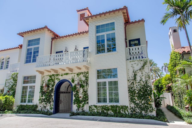 mediterranean / spanish house with a balcony