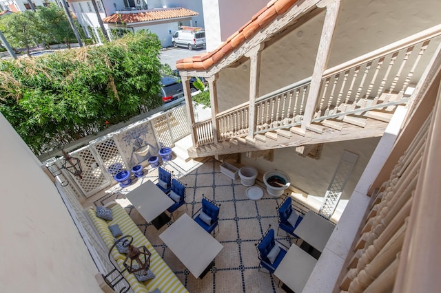 view of patio featuring a balcony