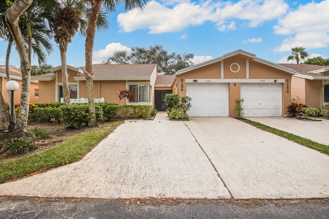 single story home featuring a garage