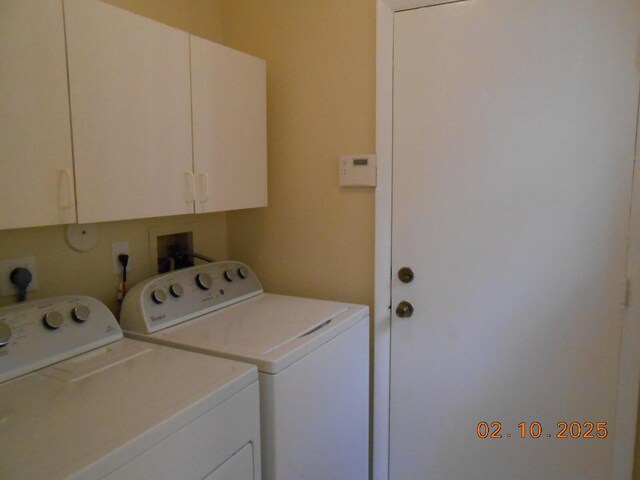 kitchen with lofted ceiling, sink, white cabinetry, black appliances, and dark stone counters