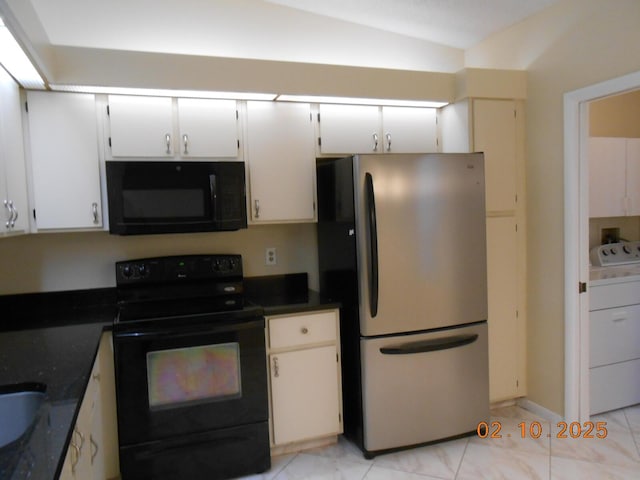 kitchen featuring white cabinetry, washer / clothes dryer, black appliances, and lofted ceiling