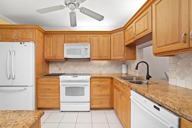 kitchen with sink, white appliances, light tile patterned floors, backsplash, and light stone countertops