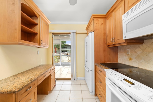 kitchen with built in desk, decorative backsplash, light tile patterned floors, crown molding, and white appliances