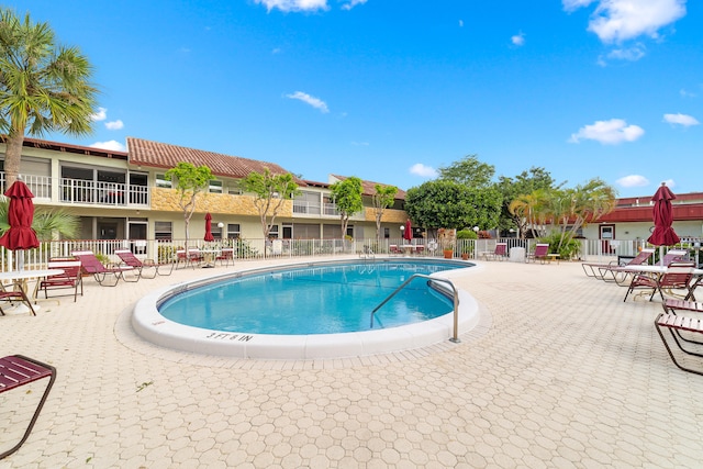 view of pool featuring a patio