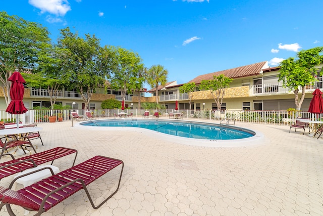 view of pool featuring a patio area