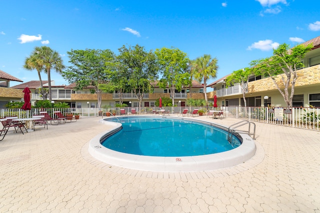 view of pool featuring a patio