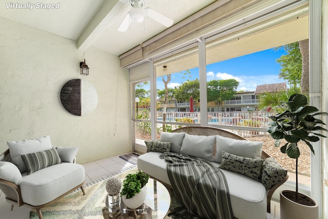 sunroom / solarium featuring ceiling fan and a healthy amount of sunlight