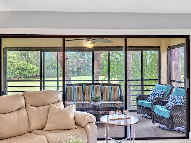 sunroom with ceiling fan and a wealth of natural light