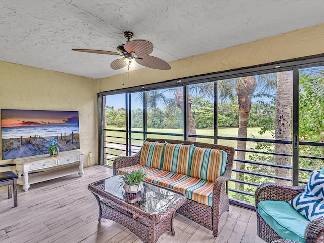 sunroom / solarium with ceiling fan