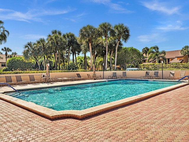 view of swimming pool featuring a patio