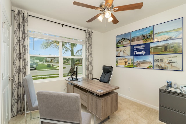 carpeted home office with ceiling fan