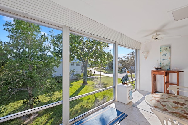 sunroom / solarium featuring ceiling fan