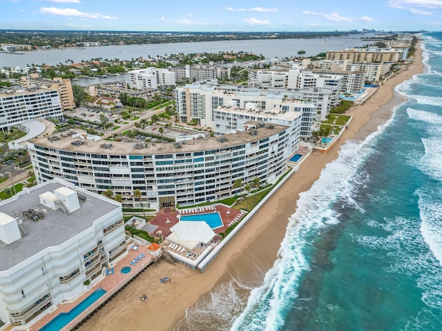 birds eye view of property featuring a water view and a view of the beach