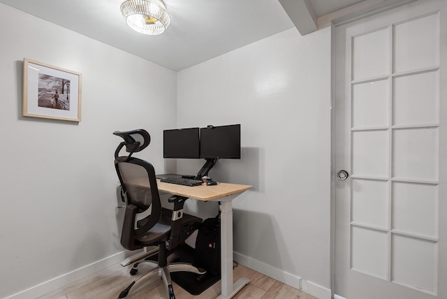 home office with light wood-type flooring