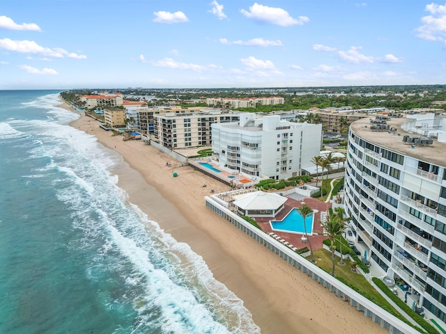 drone / aerial view featuring a view of the beach and a water view