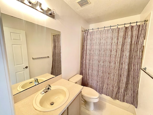 full bathroom featuring vanity, shower / tub combo, a textured ceiling, and toilet