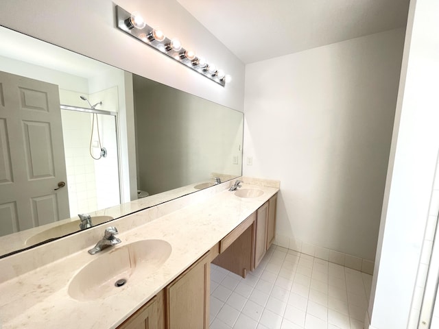 bathroom featuring vanity, an enclosed shower, and toilet