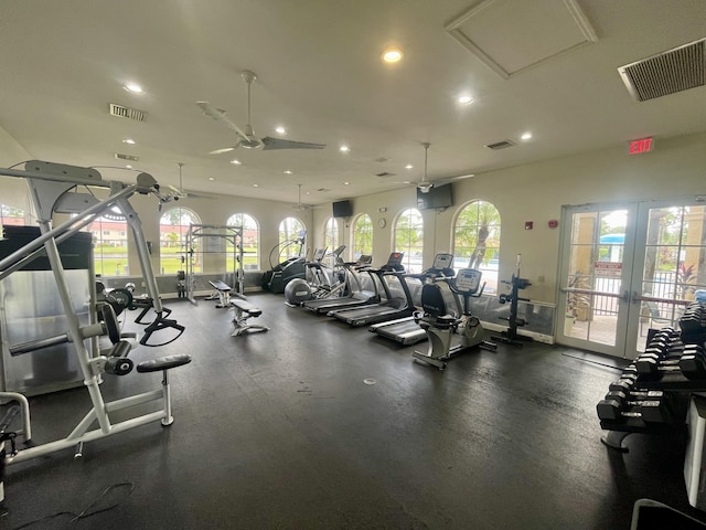 workout area with a wealth of natural light, french doors, and ceiling fan