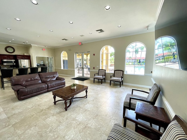 living room with crown molding and french doors