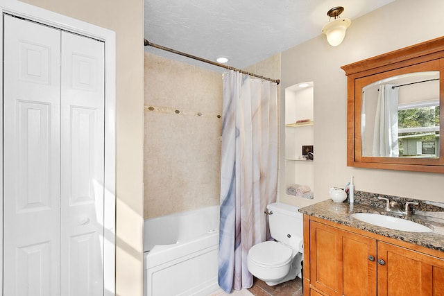 full bathroom with toilet, vanity, shower / bath combination with curtain, and a textured ceiling