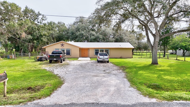 ranch-style house with a front yard