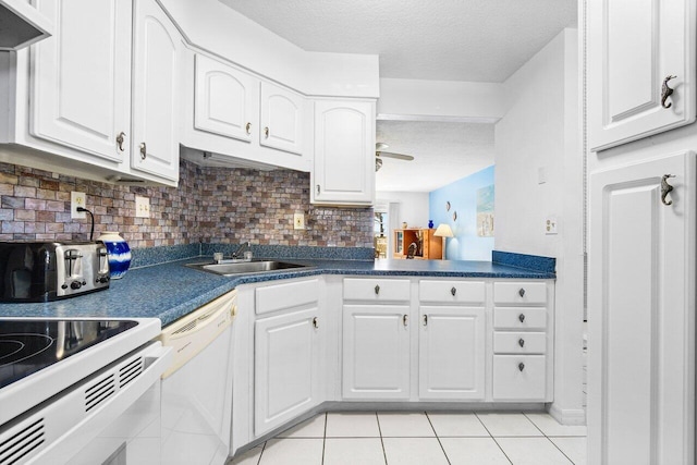 kitchen with dishwasher, white cabinets, sink, and tasteful backsplash