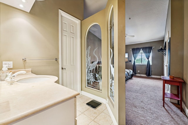 bathroom with vanity, tile patterned floors, and a textured ceiling