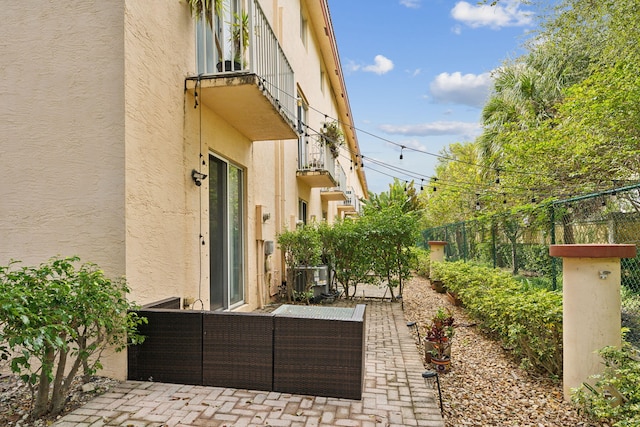 view of patio with a balcony