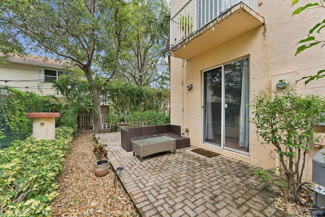 view of patio featuring a balcony