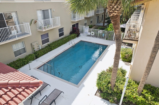 view of swimming pool featuring a patio area