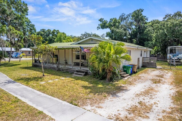 bungalow-style home with a front yard and a porch