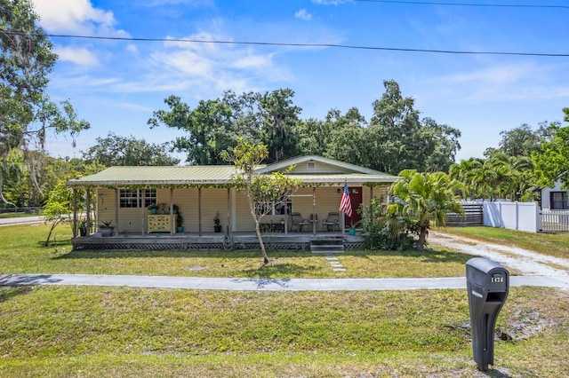 view of front of home with a porch and a front lawn