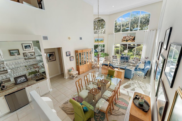 12020 SE Birkdale Run, Jupiter, FL 33469 - dining area with plenty of natural light, a high ceiling, light tile patterned flooring, and visible vents