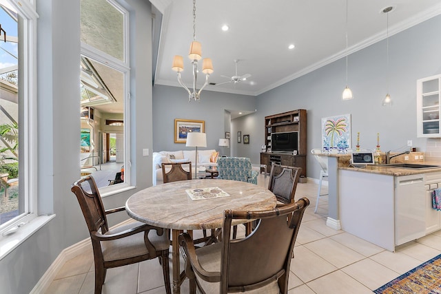 dining area with sink, light tile patterned floors, and a wealth of natural light