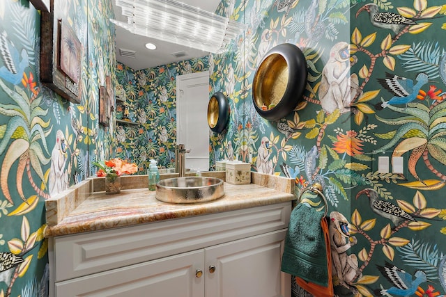 12020 SE Birkdale Run, Jupiter, FL 33469 - bathroom featuring vanity, visible vents, and wallpapered walls