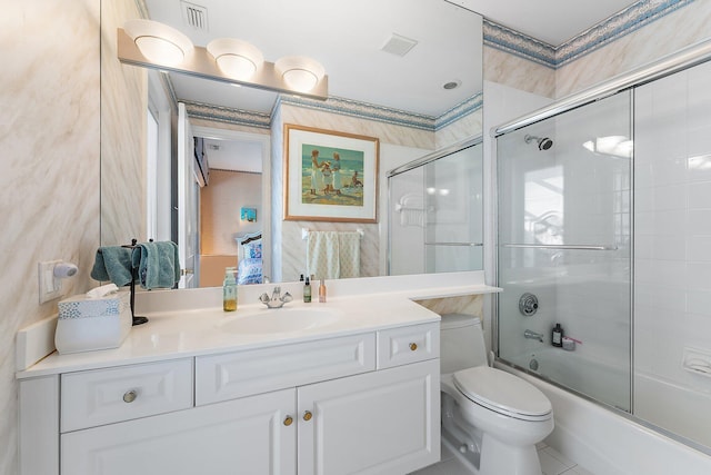 full bathroom featuring vanity, toilet, tile patterned floors, and enclosed tub / shower combo