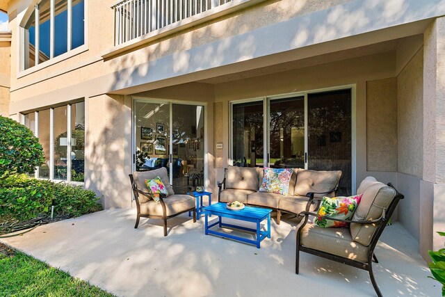 12020 SE Birkdale Run, Jupiter, FL 33469 - view of patio featuring an outdoor living space