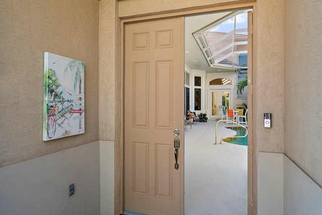 interior space featuring french doors and a patio area