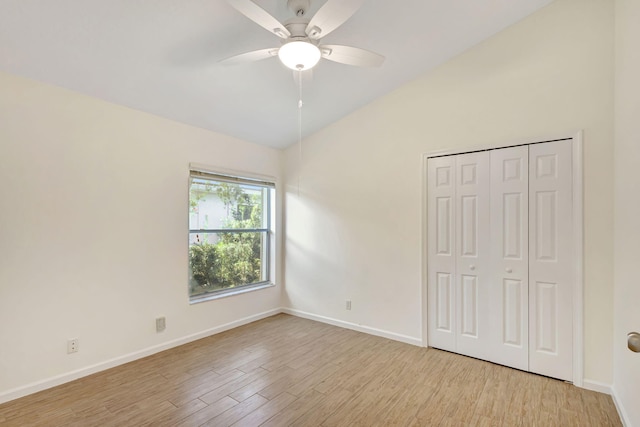 6481 Spartina Cir, Jupiter, FL 33458 - unfurnished bedroom featuring light wood finished floors, baseboards, a closet, ceiling fan, and high vaulted ceiling