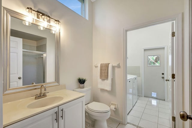 6481 Spartina Cir, Jupiter, FL 33458 - bathroom with washer and dryer, vanity, tile patterned flooring, toilet, and a shower with door
