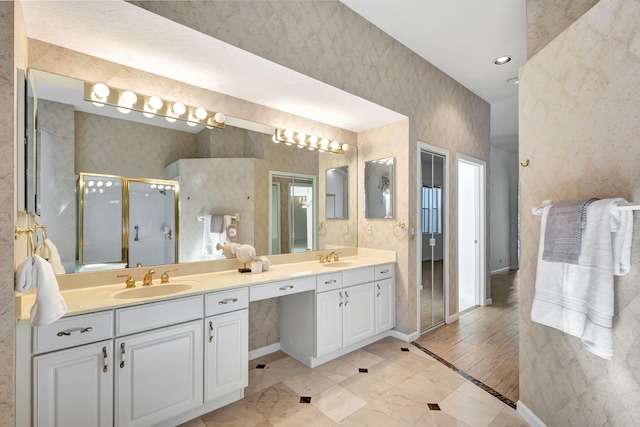 6481 Spartina Cir, Jupiter, FL 33458 - full bathroom featuring double vanity, a stall shower, baseboards, and wallpapered walls