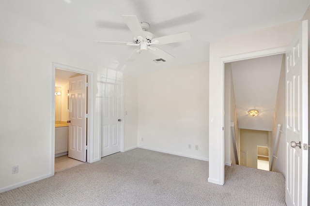 6481 Spartina Cir, Jupiter, FL 33458 - unfurnished bedroom featuring light colored carpet, baseboards, connected bathroom, and ceiling fan